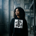 Model wearing the Eat The Rich cropped hoodie